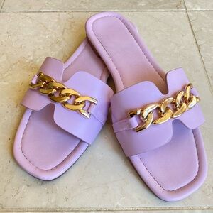 Lavender colored sandal with gold chain embellishment